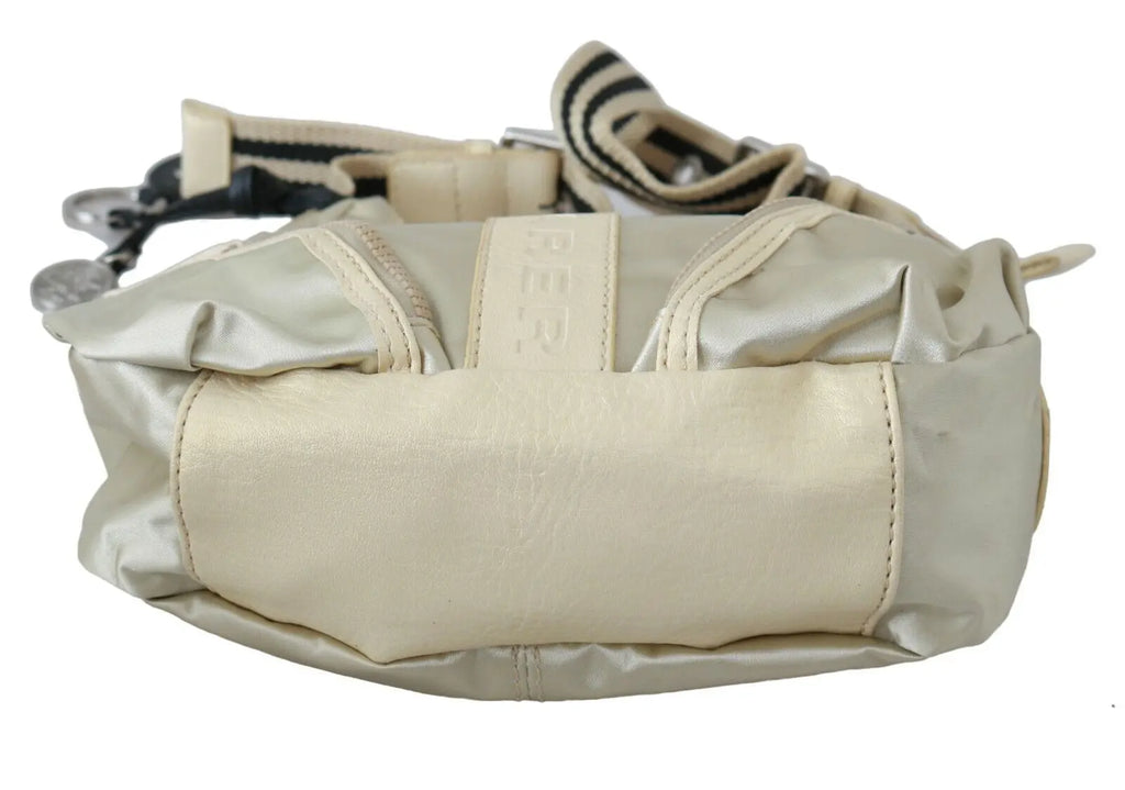 White fabric crossbody sling bag with beige trim and adjustable striped shoulder strap.