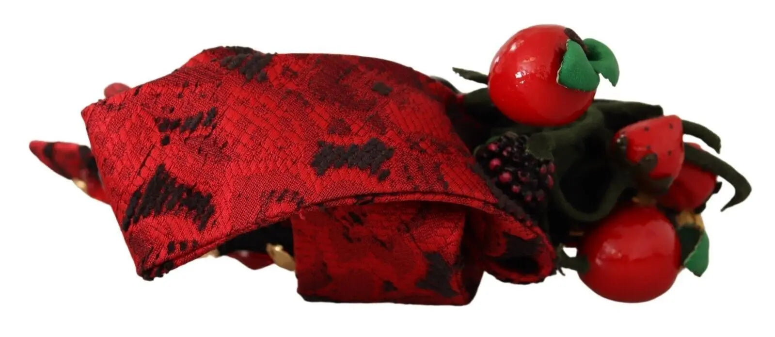 Red fabric headband adorned with crystal-embellished berry and bow details.