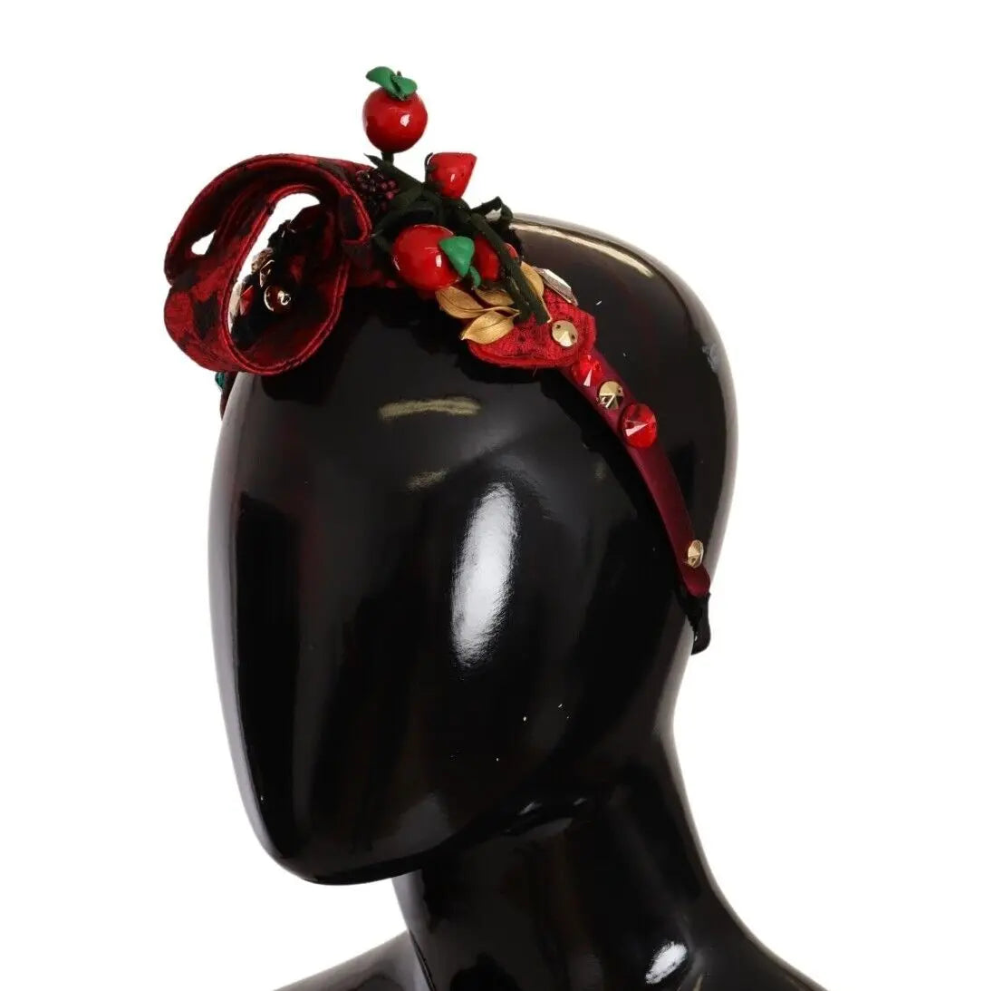 Red fabric headband adorned with crystal-embellished berry and bow details.