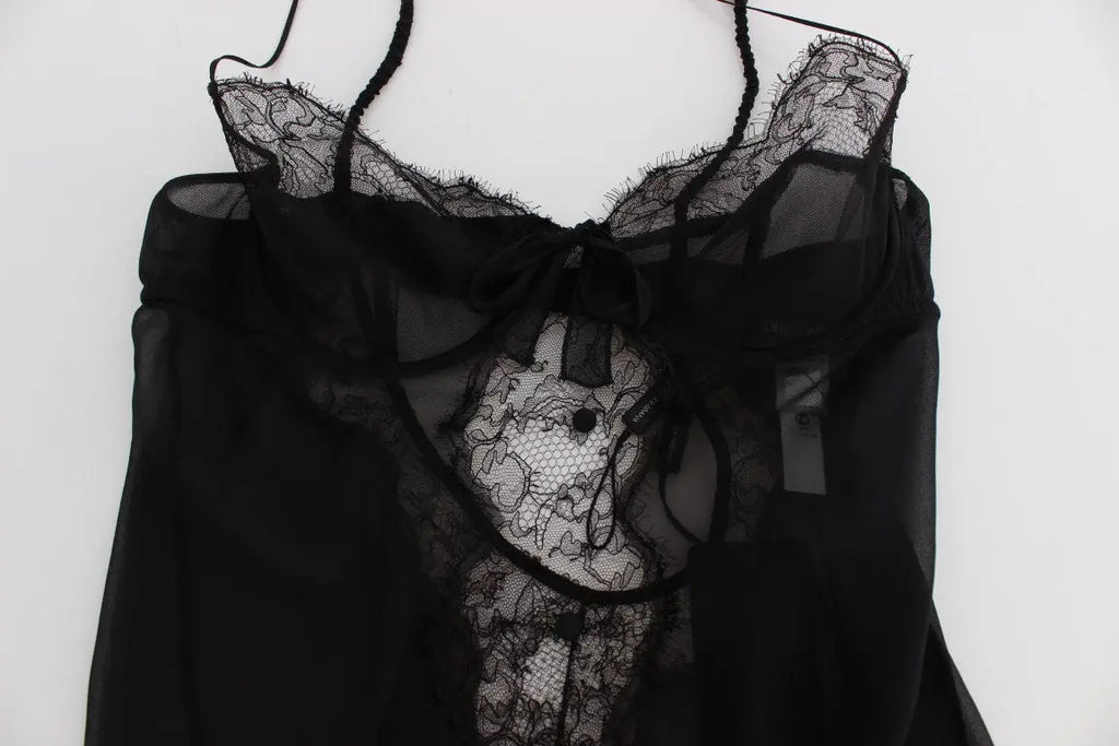 Black silk babydoll lingerie top with lace trim and scalloped hem, sheer fabric, and thin spaghetti straps.
