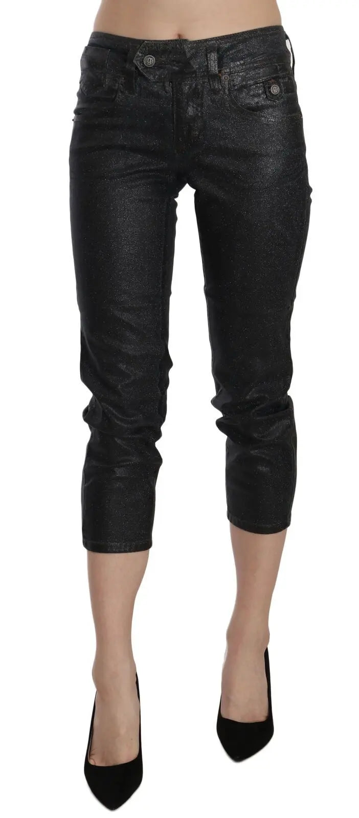 Black washed slim leg cropped denim pants with mid waist and button closure.