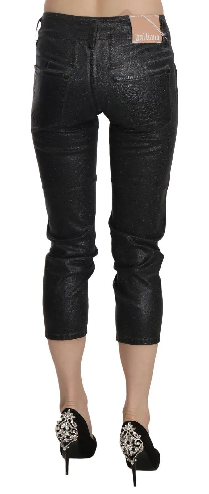 Black washed slim leg cropped denim pants with mid waist and button closure.