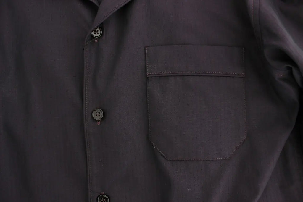 Black button-up long-sleeve cotton shirt with a chest pocket on the left side.