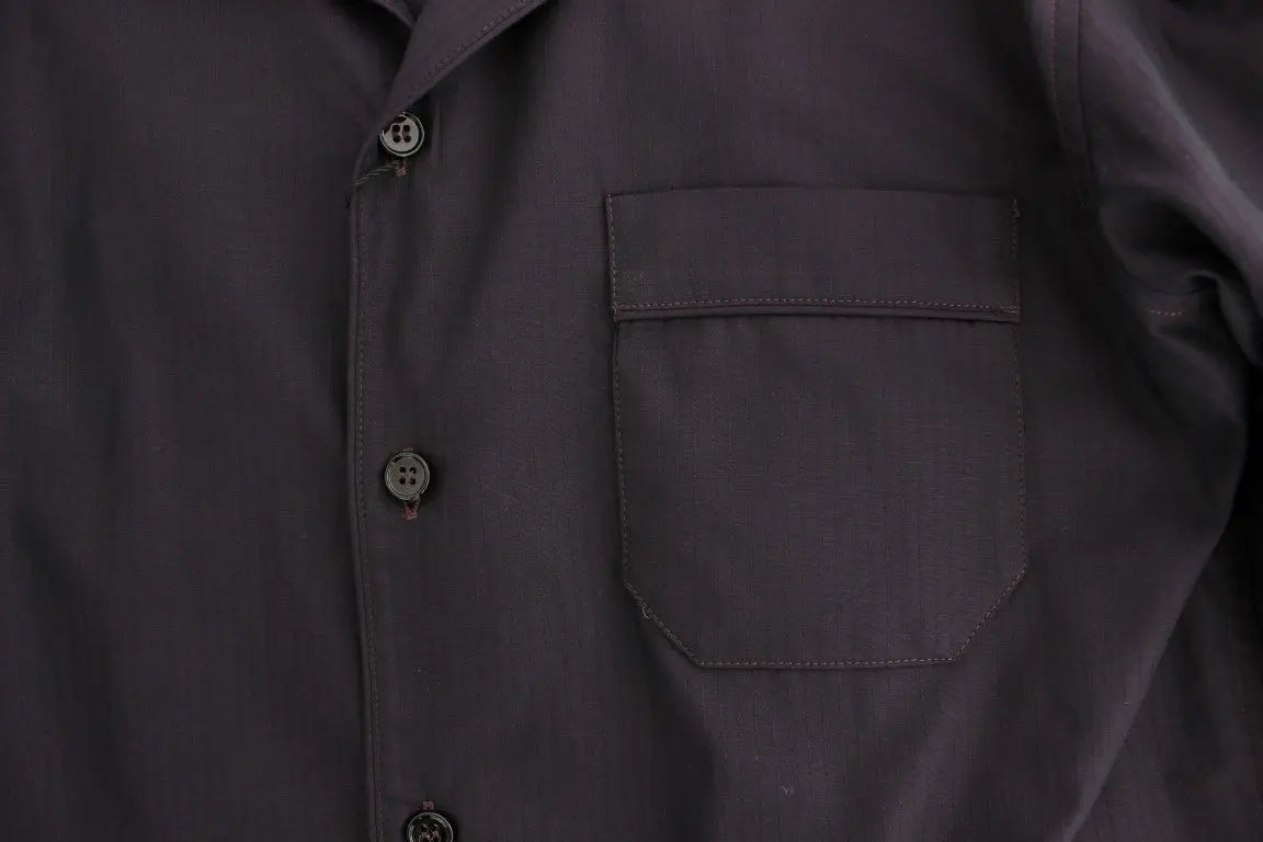 Black button-up long-sleeve cotton shirt with a chest pocket on the left side.