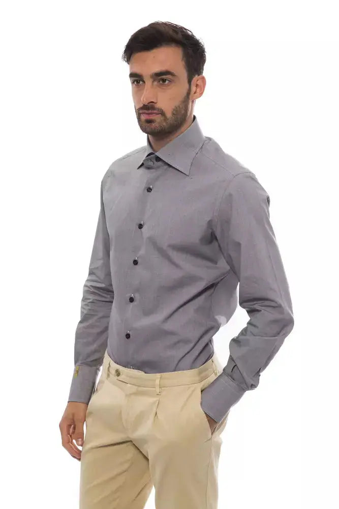 Slim-fit black cotton men’s dress shirt with black buttons and a pointed collar.