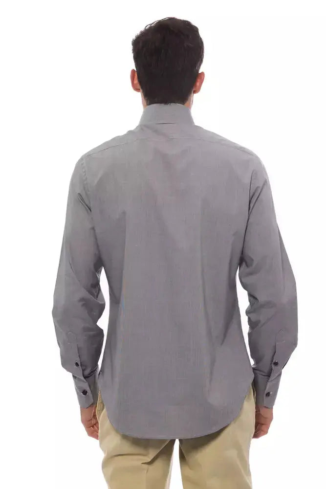 Slim-fit black cotton men’s dress shirt with black buttons and a pointed collar.