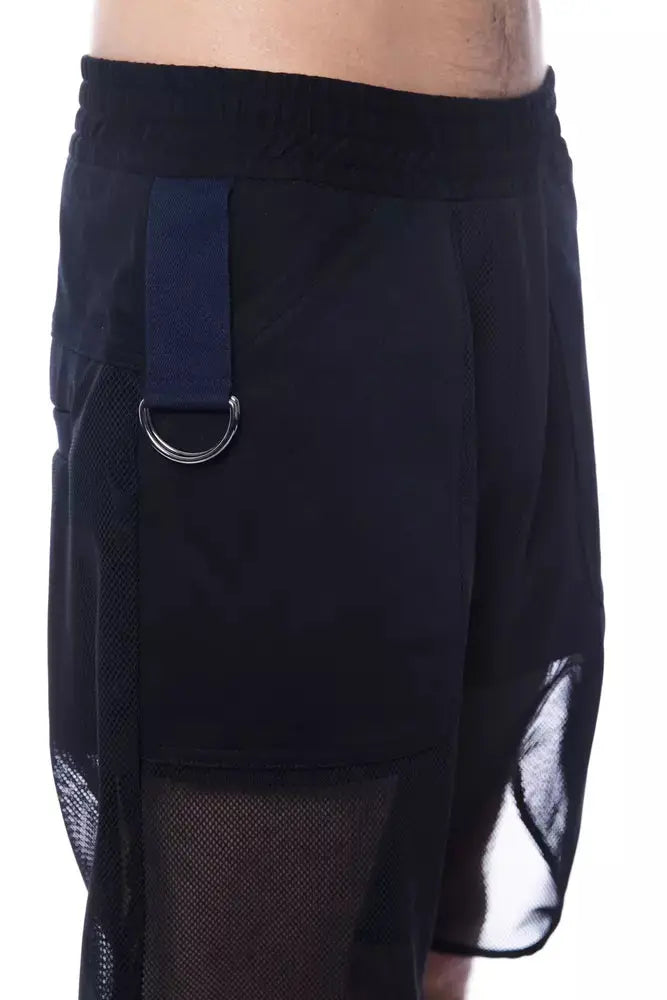 Black polyester men's sports shorts with mesh overlay and elastic waistband.