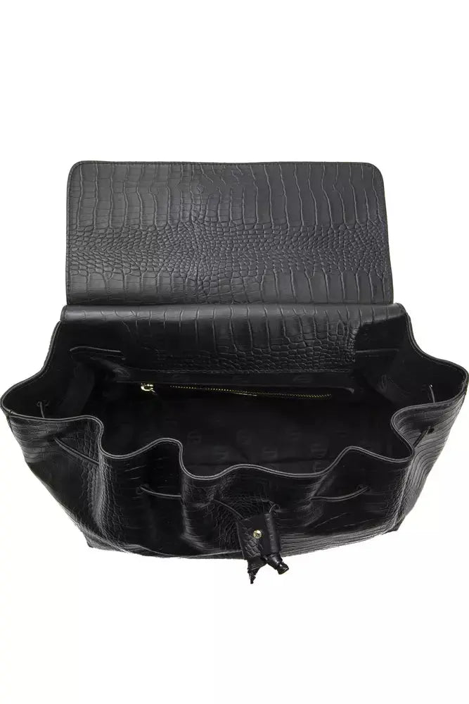 Black leather women’s shoulder bag with textured flap and silver rectangular plaque.