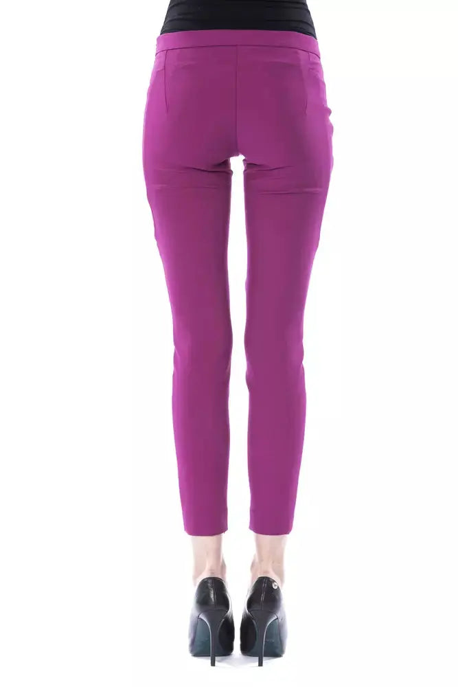 Slim-fit purple polyester women’s pants with mid-rise waist and ankle length.