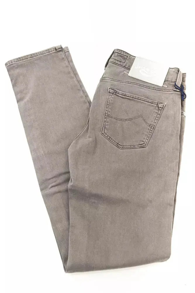 Folded gray slim fit cotton jeans for women with back pocket and belt loops.