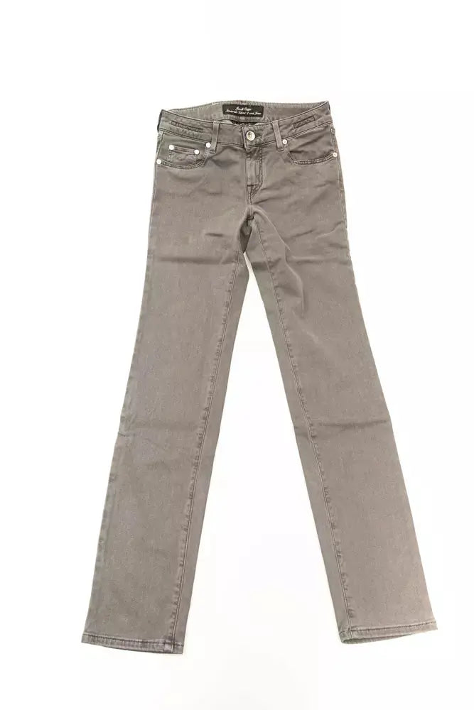 Folded gray slim fit cotton jeans for women with back pocket and belt loops.