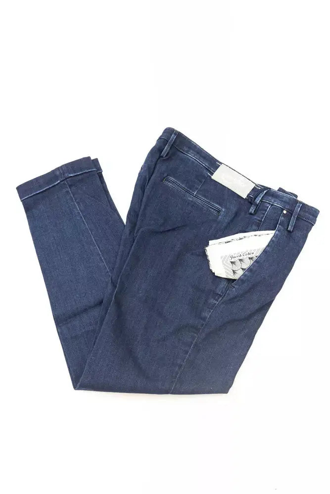 Folded blue cotton women's jeans with classic five-pocket design and white label on waistband.