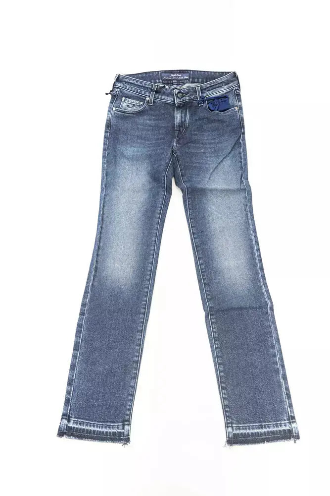 Folded slim fit blue cotton women's jeans with subtle fading and a back pocket patch.