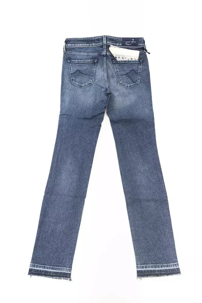 Folded slim fit blue cotton women's jeans with subtle fading and a back pocket patch.
