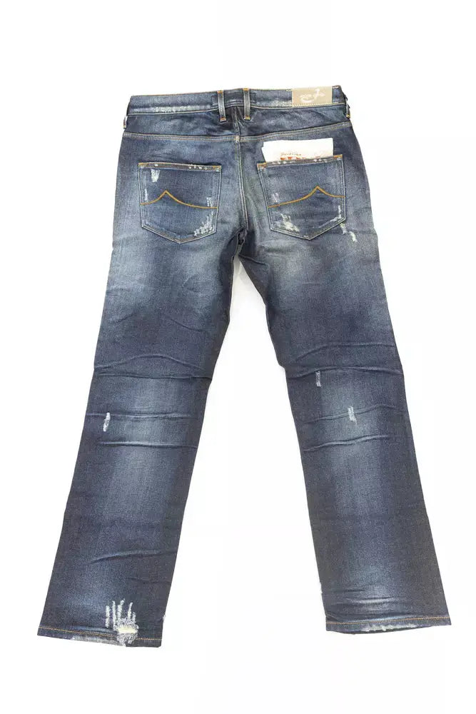 Folded blue cotton straight-leg jeans with faded wash and subtle distressing on knee and pocket areas.