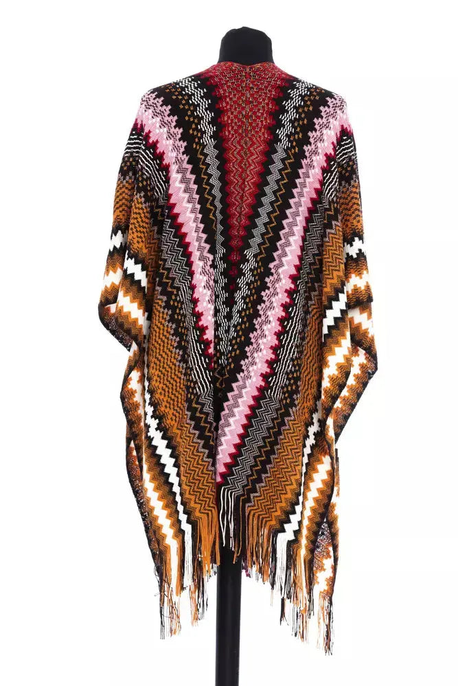 Multicolor wool poncho with zigzag pattern in pink, brown, black, white, and orange, fringed edges.