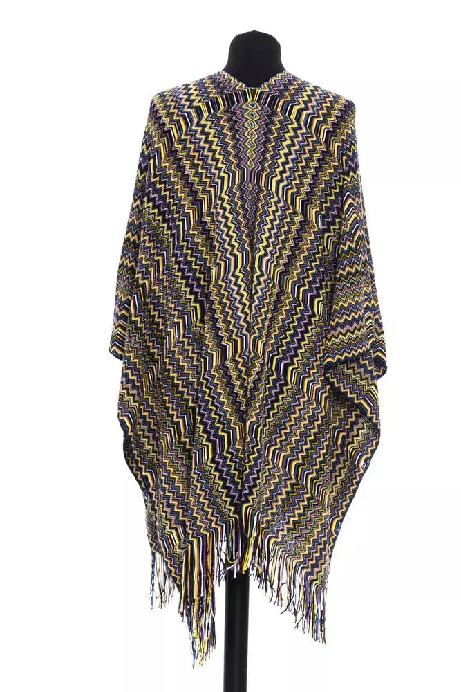 Multicolor wool poncho with zigzag pattern and fringe hem on black mannequin.