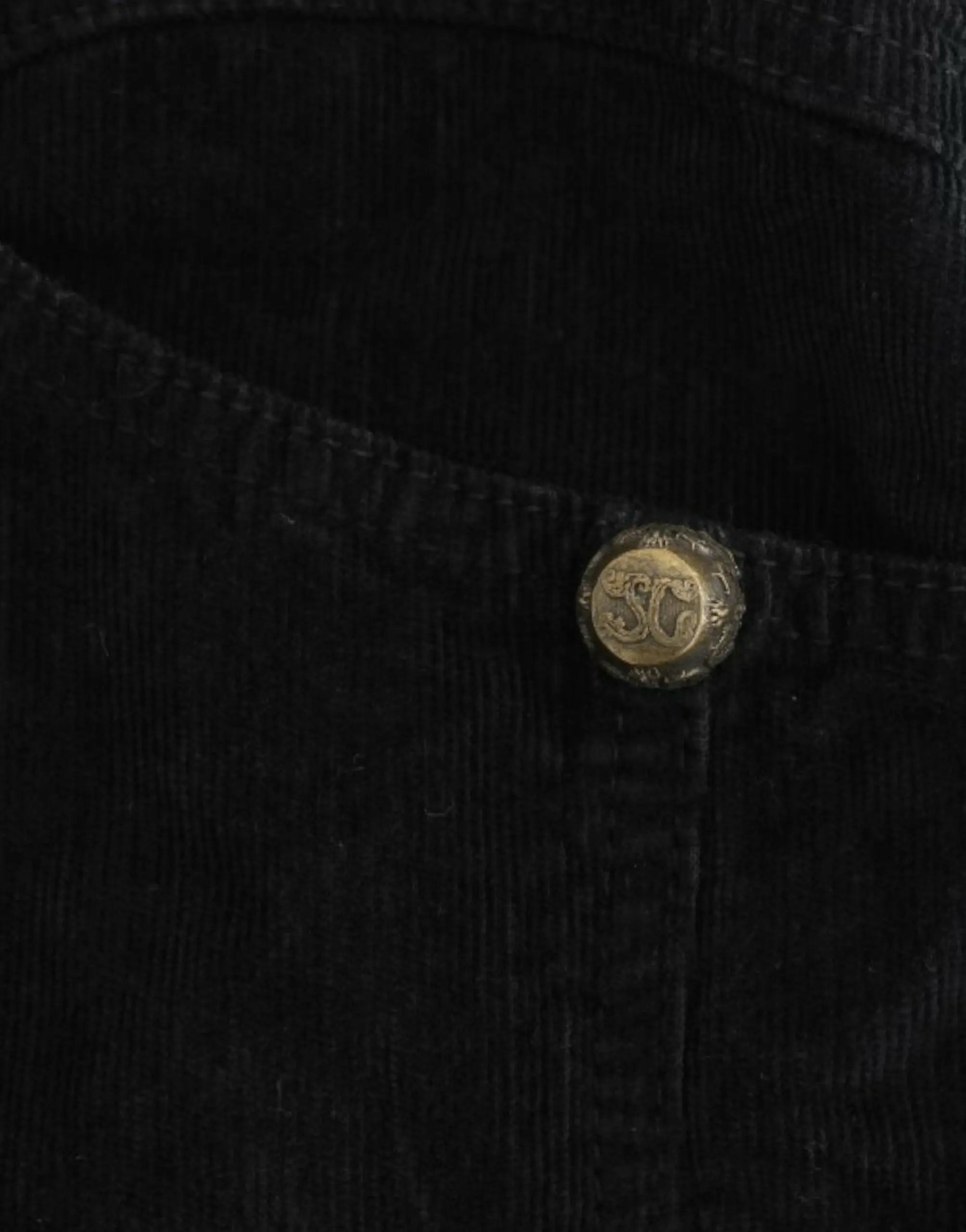 Black corduroy pencil skirt with front zipper and high waist, midi length.