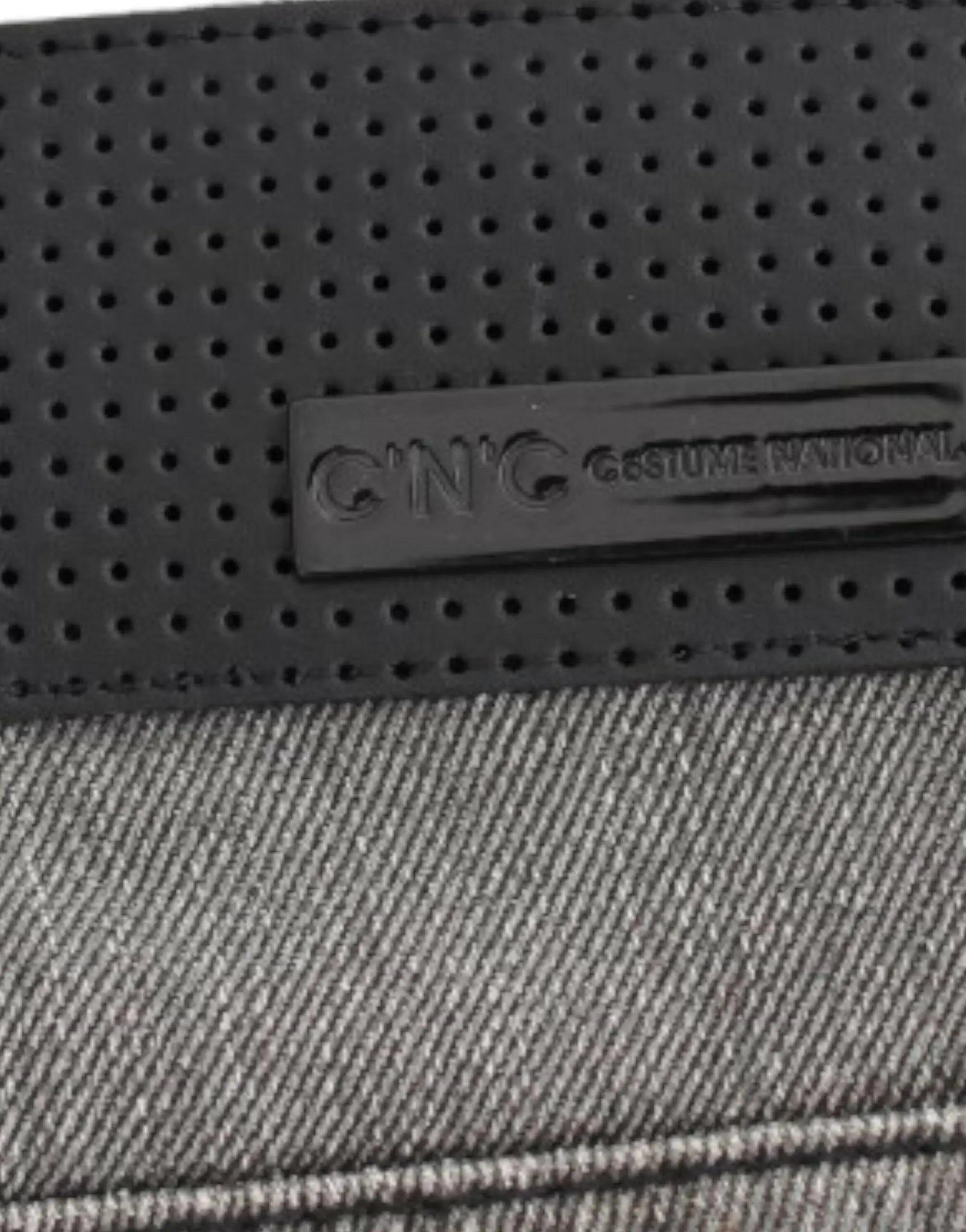 Gray straight-leg jeans with slight distressing on upper thighs and knees, mid-rise fit.