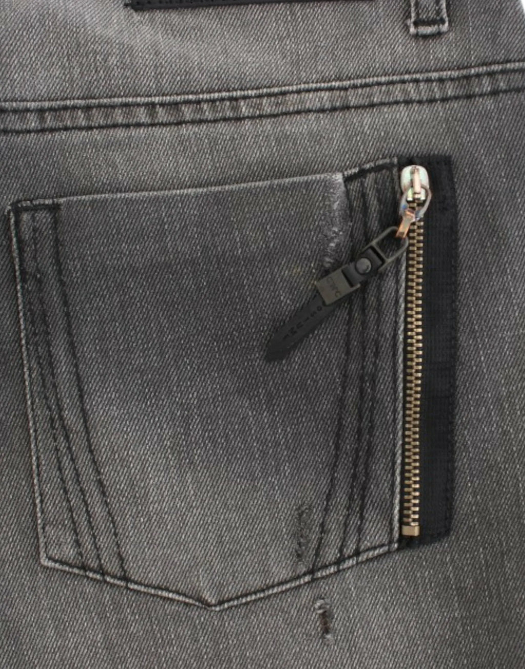 Gray straight-leg jeans with slight distressing on upper thighs and knees, mid-rise fit.