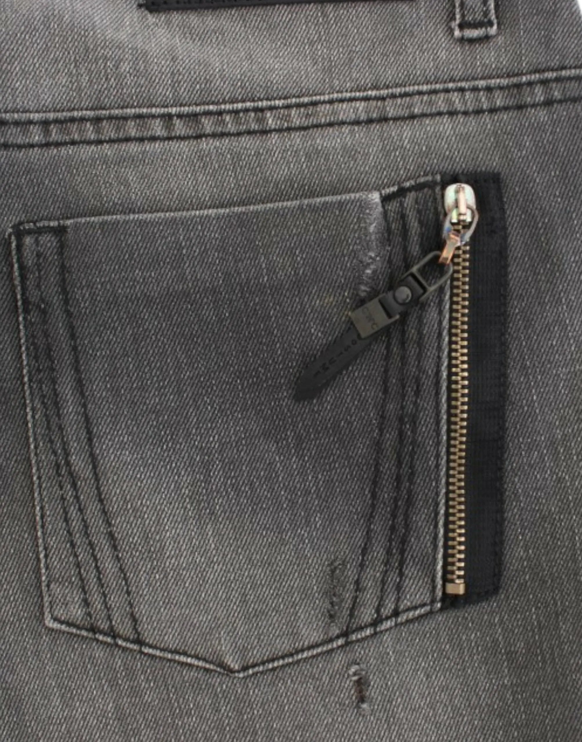 Gray straight-leg jeans with slight distressing on upper thighs and knees, mid-rise fit.