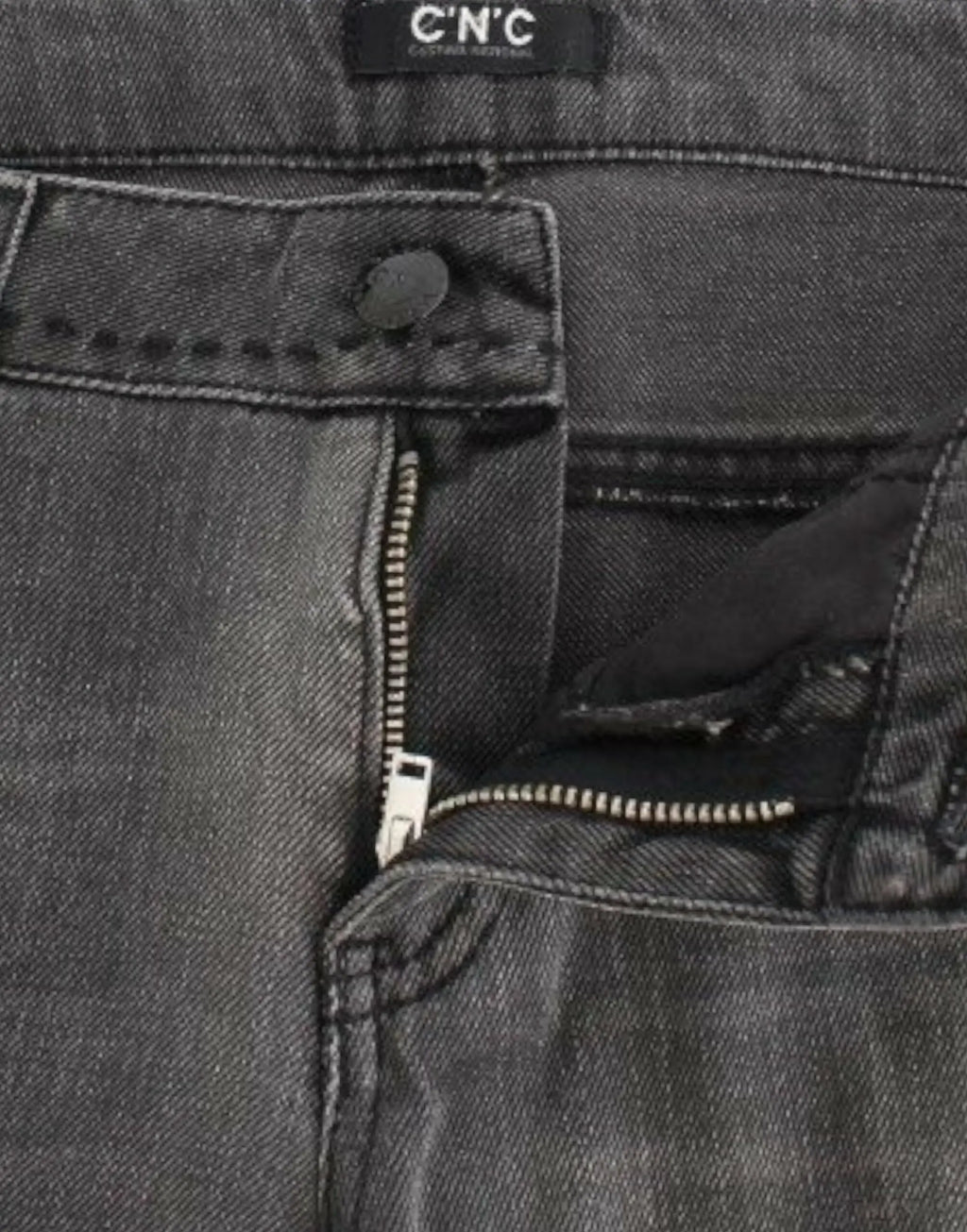 Gray straight-leg jeans with slight distressing on upper thighs and knees, mid-rise fit.