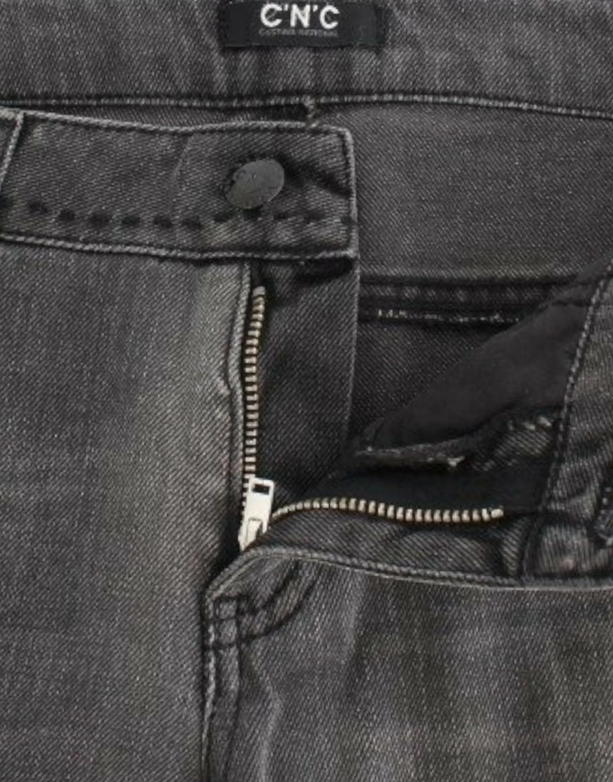 Gray straight-leg jeans with slight distressing on upper thighs and knees, mid-rise fit.