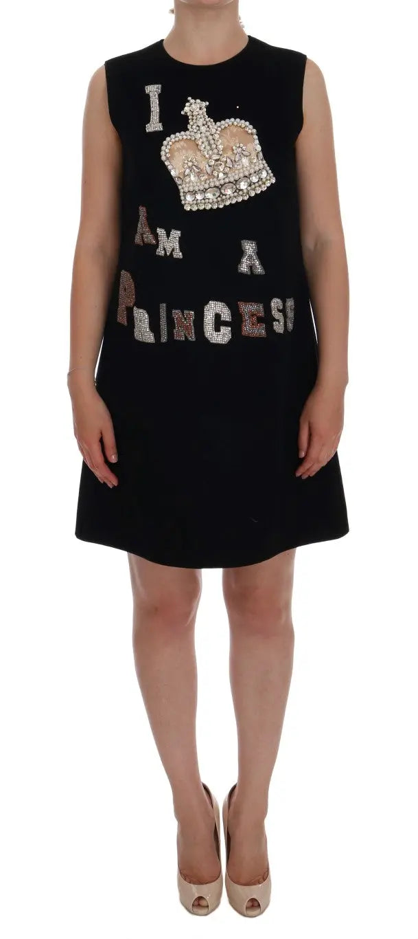 Black sleeveless wool shift dress with "I AM A PRINCESS" crystal embellishments and crown motif.