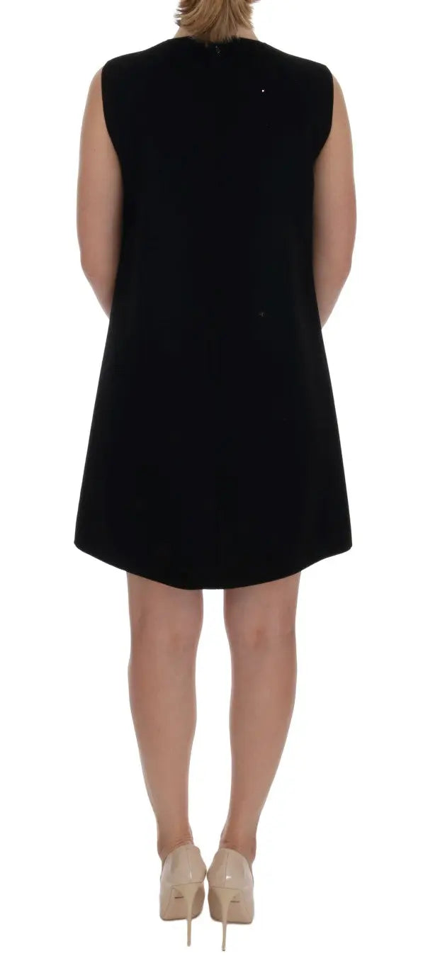 Black sleeveless wool shift dress with "I AM A PRINCESS" crystal embellishments and crown motif.