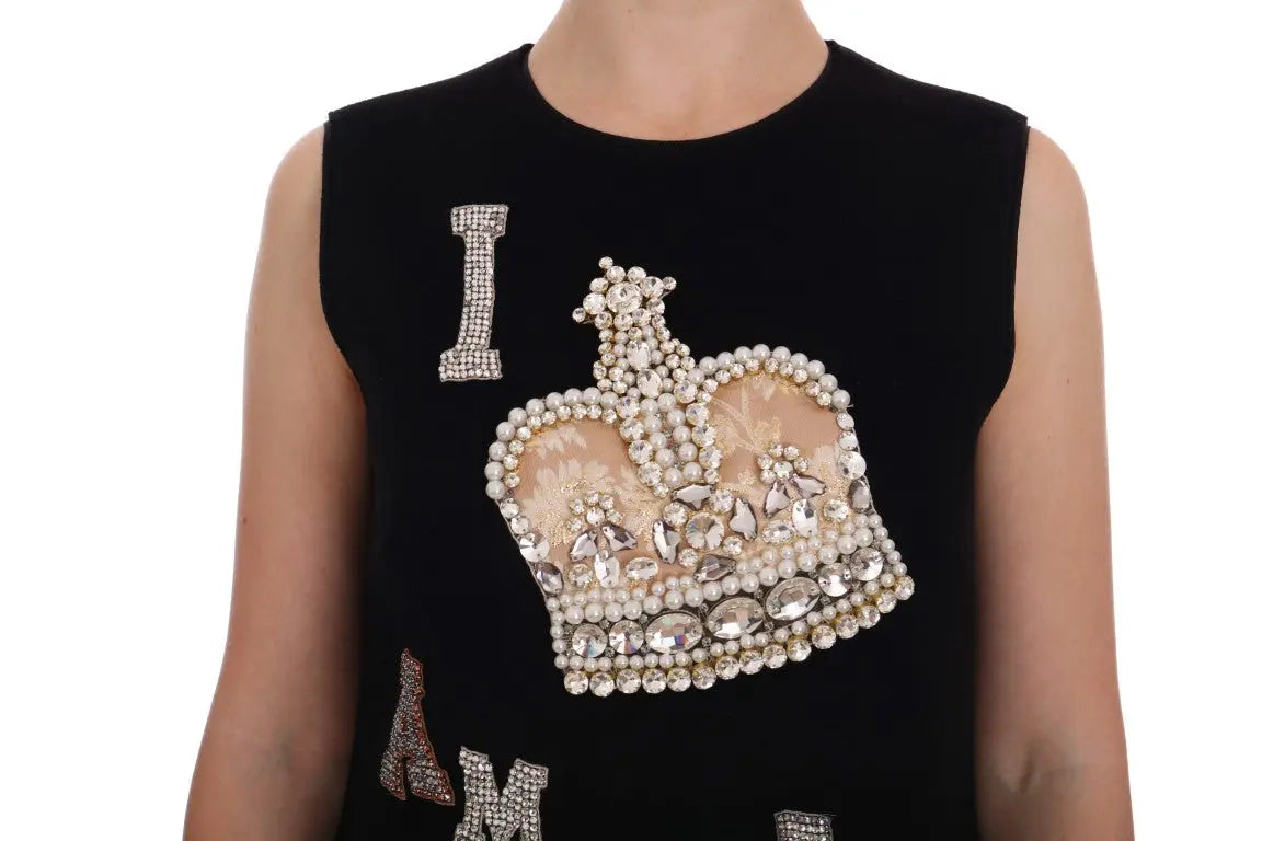 Black sleeveless wool shift dress with "I AM A PRINCESS" crystal embellishments and crown motif.
