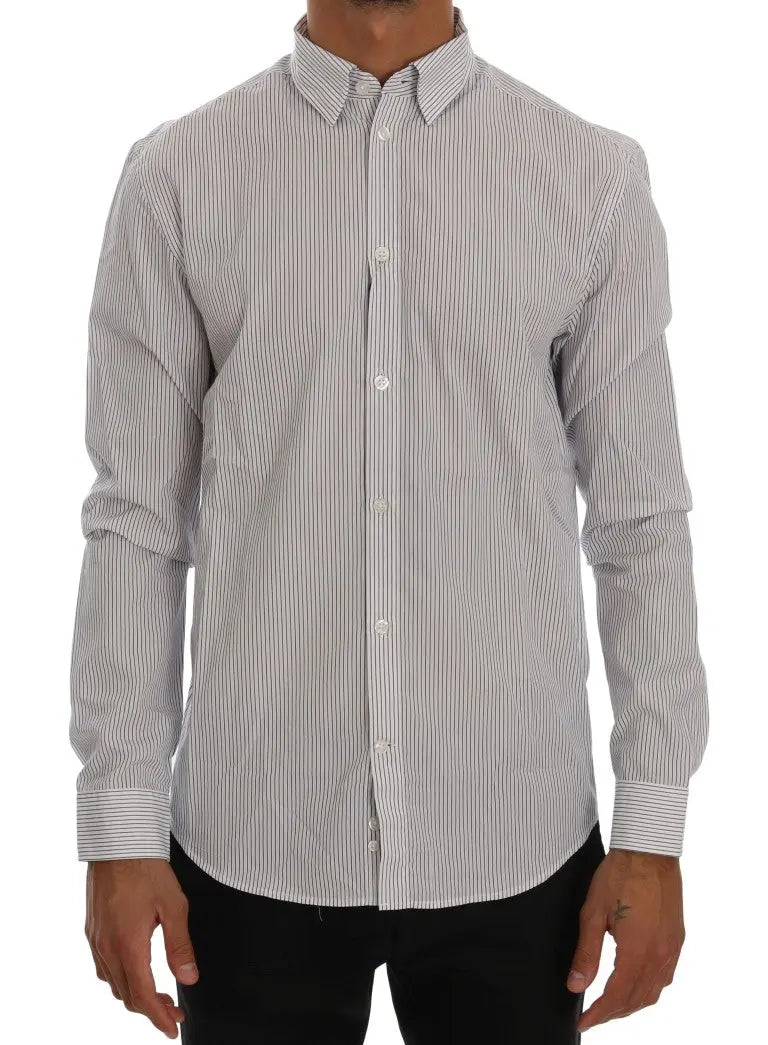 White cotton shirt with thin blue vertical stripes, button-down collar, and long sleeves.