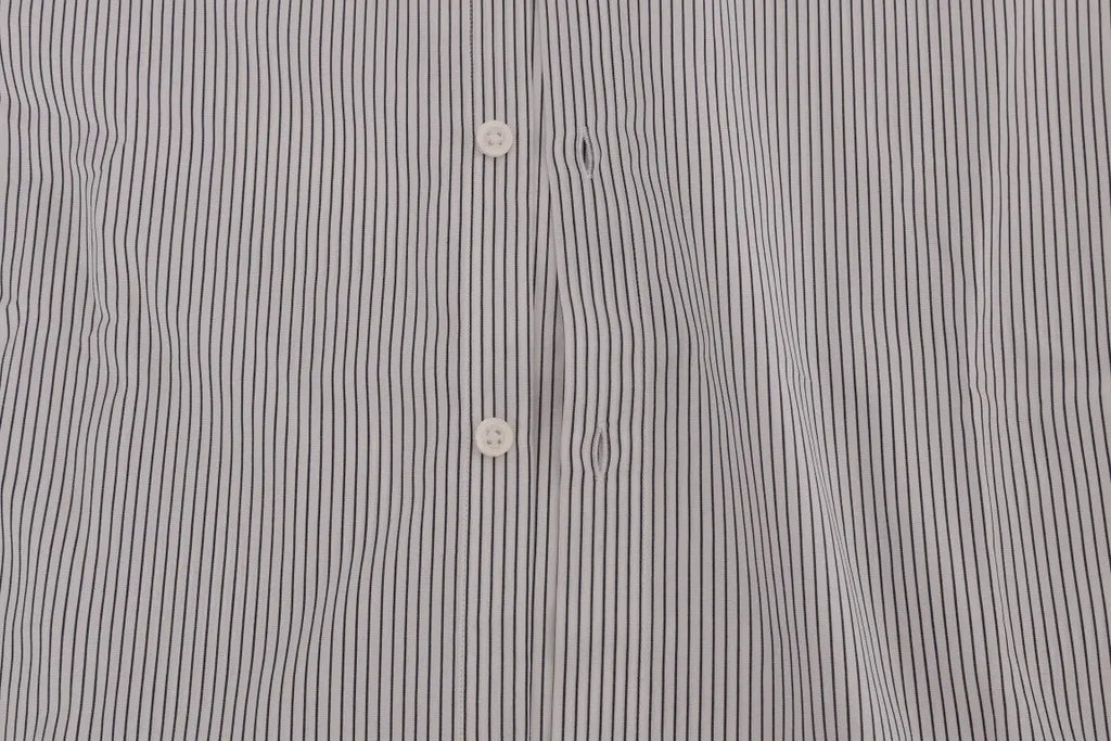 White cotton shirt with thin blue vertical stripes, button-down collar, and long sleeves.