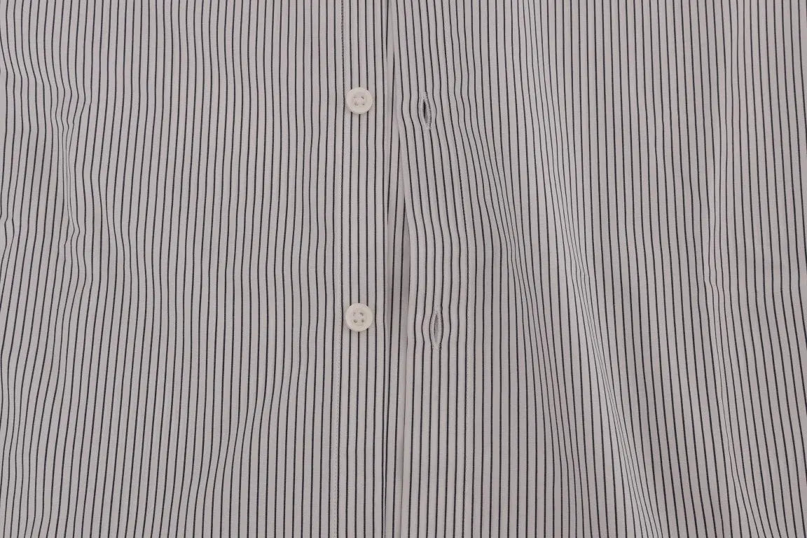 White cotton shirt with thin blue vertical stripes, button-down collar, and long sleeves.