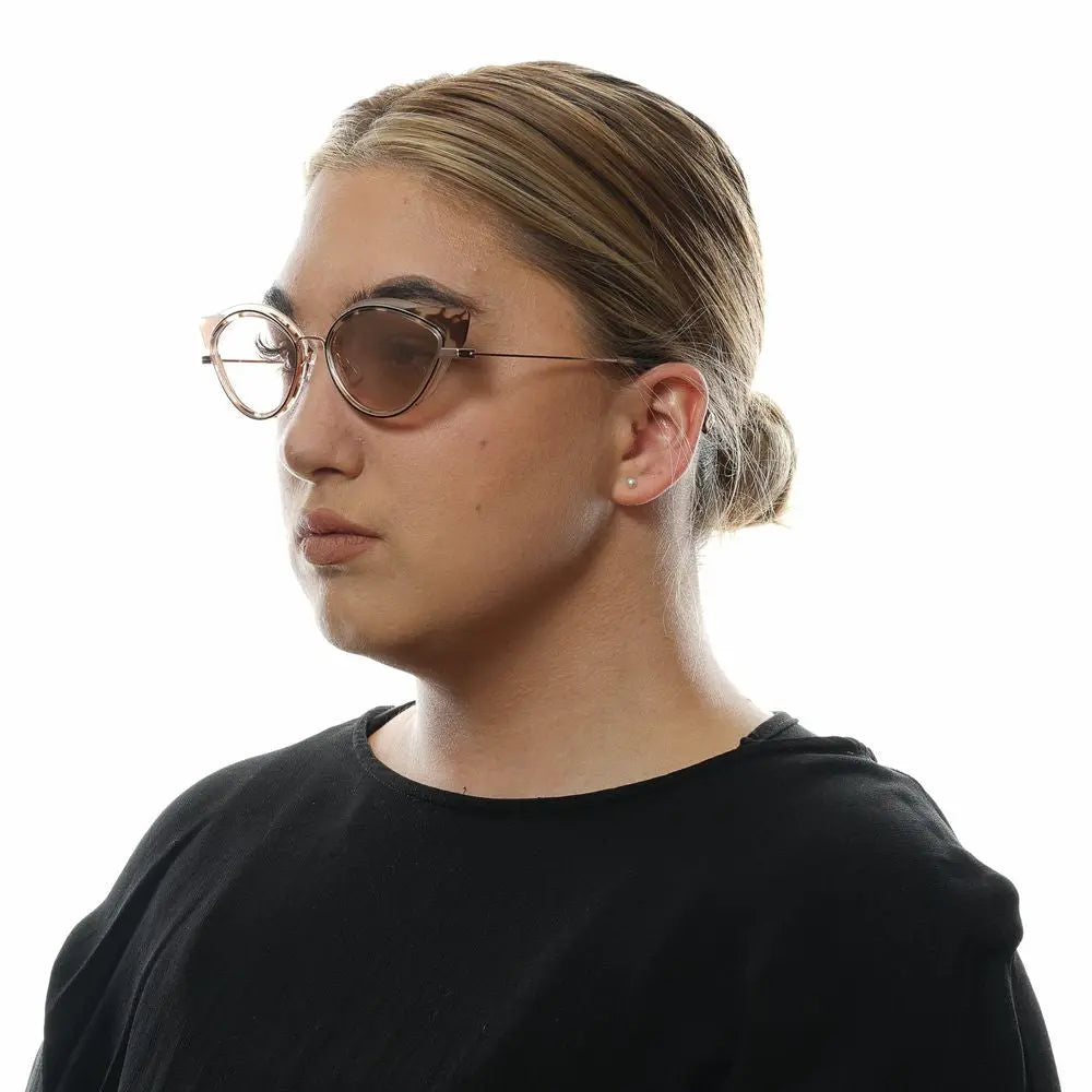 Brown cat-eye sunglasses with metal rims and translucent plastic arms.
