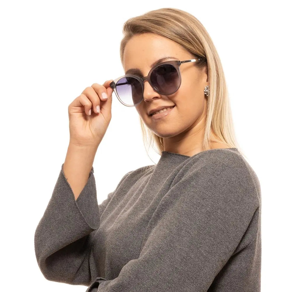 Gray oversized round plastic sunglasses with gradient lenses and metal hinge detail.