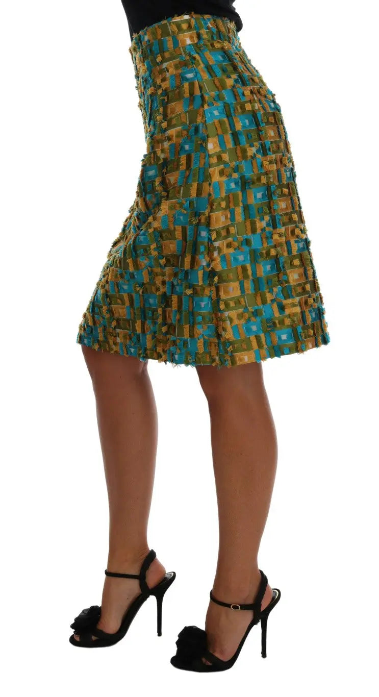 Multicolor jacquard midi pencil skirt with blue, gold, and black checkered pattern and high waist.