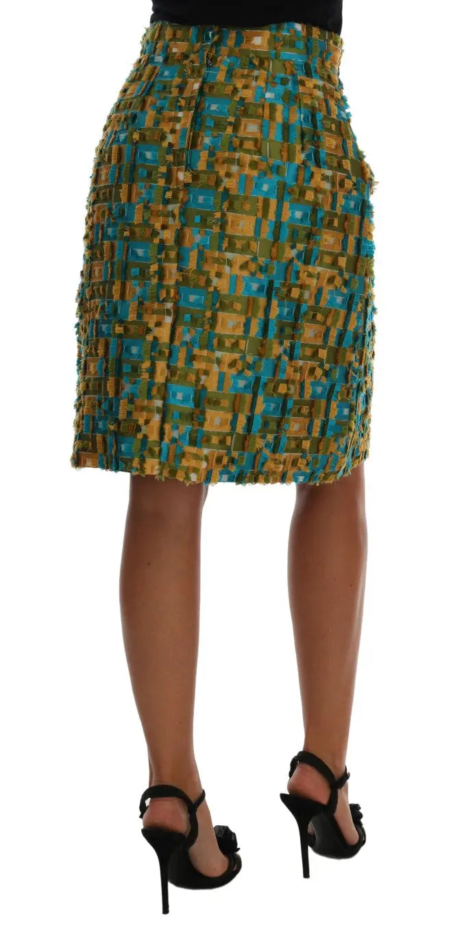 Multicolor jacquard midi pencil skirt with blue, gold, and black checkered pattern and high waist.