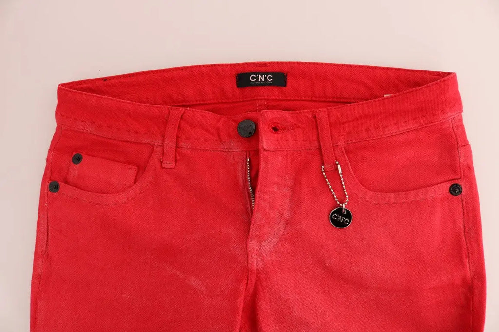 Red slim fit women's jeans in stretch cotton with classic five-pocket design and zip fly closure.