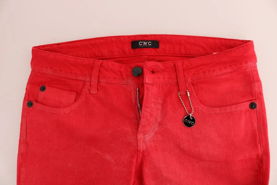 Red slim fit women's jeans in stretch cotton with classic five-pocket design and zip fly closure.