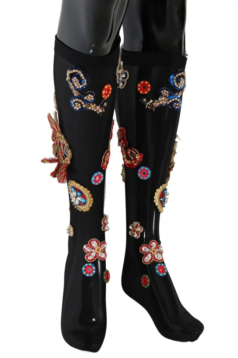Black knee-high stretch socks with colorful crystal-embellished floral and paisley patterns.