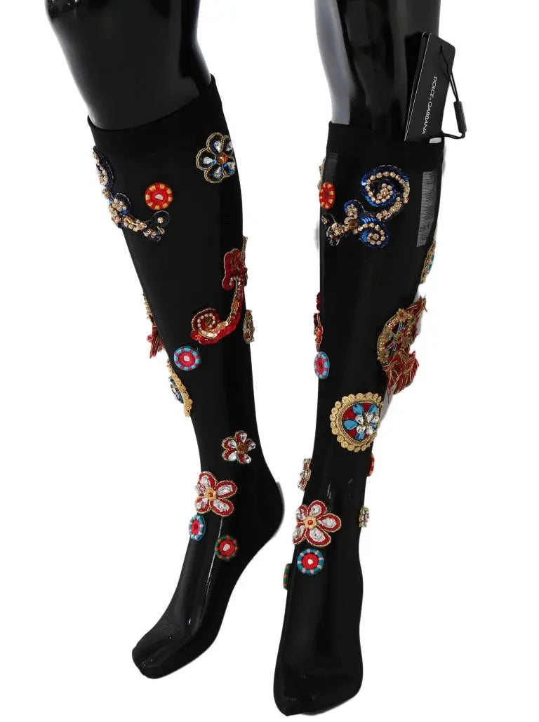 Black knee-high stretch socks with colorful crystal-embellished floral and paisley patterns.