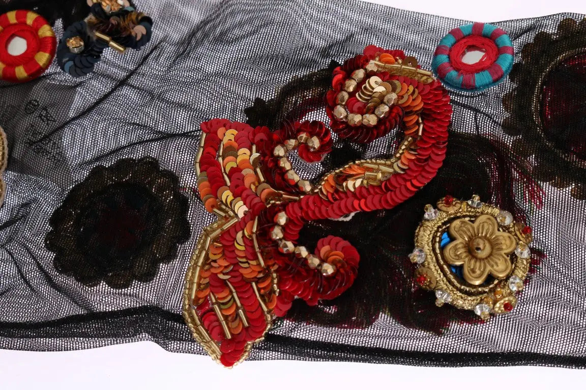 Black knee-high stretch socks with colorful crystal-embellished floral and paisley patterns.