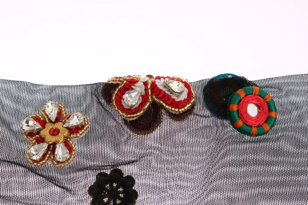 Black knee-high stretch socks with colorful crystal-embellished floral and paisley patterns.