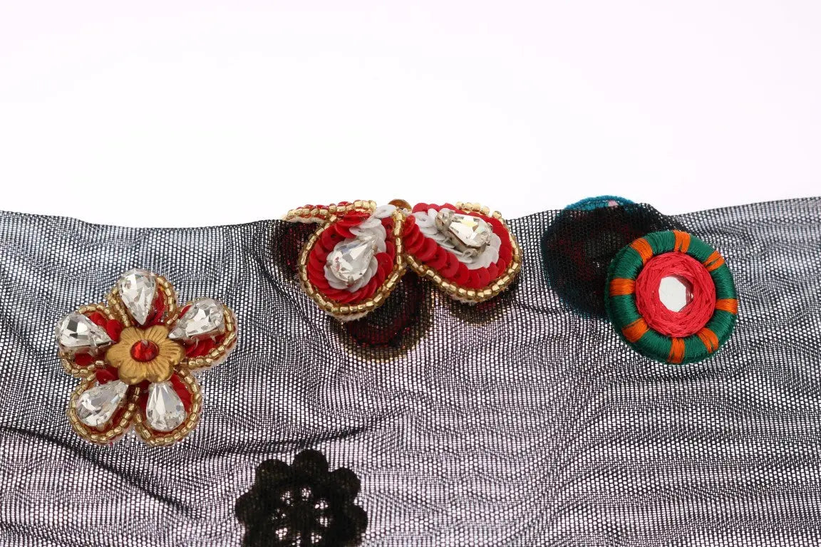 Black knee-high stretch socks with colorful crystal-embellished floral and paisley patterns.