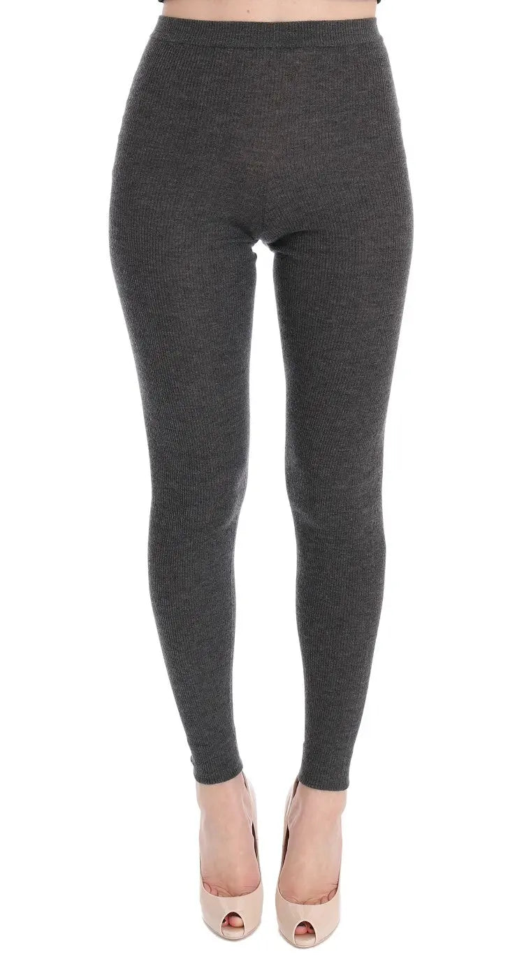 Dark gray cashmere stretch tights with a high waist and slim fit on a model.