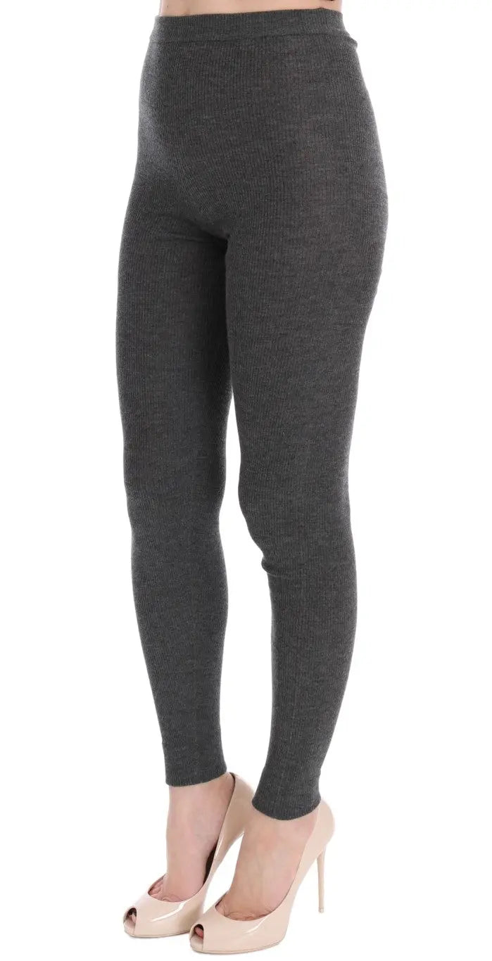 Dark gray cashmere stretch tights with a high waist and slim fit on a model.