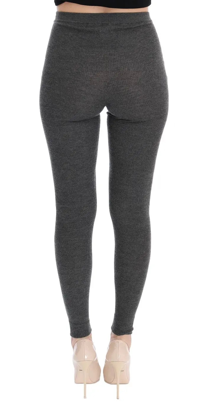 Dark gray cashmere stretch tights with a high waist and slim fit on a model.