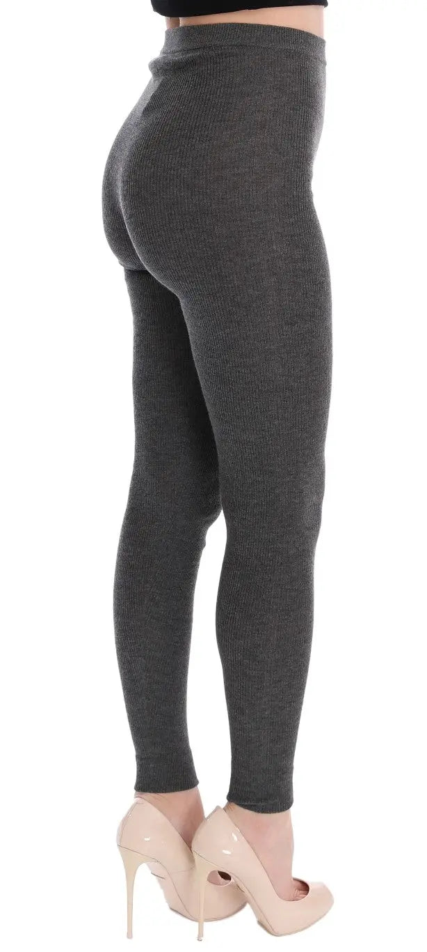 Dark gray cashmere stretch tights with a high waist and slim fit on a model.