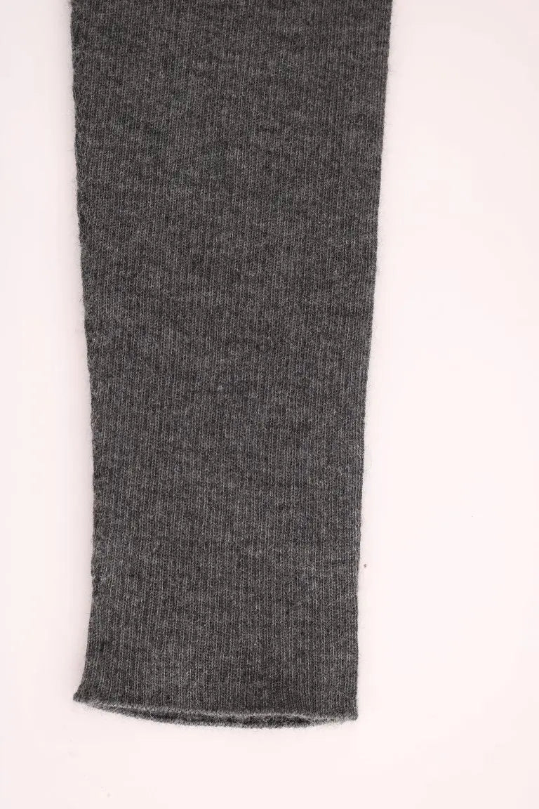 Dark gray cashmere stretch tights with a high waist and slim fit on a model.