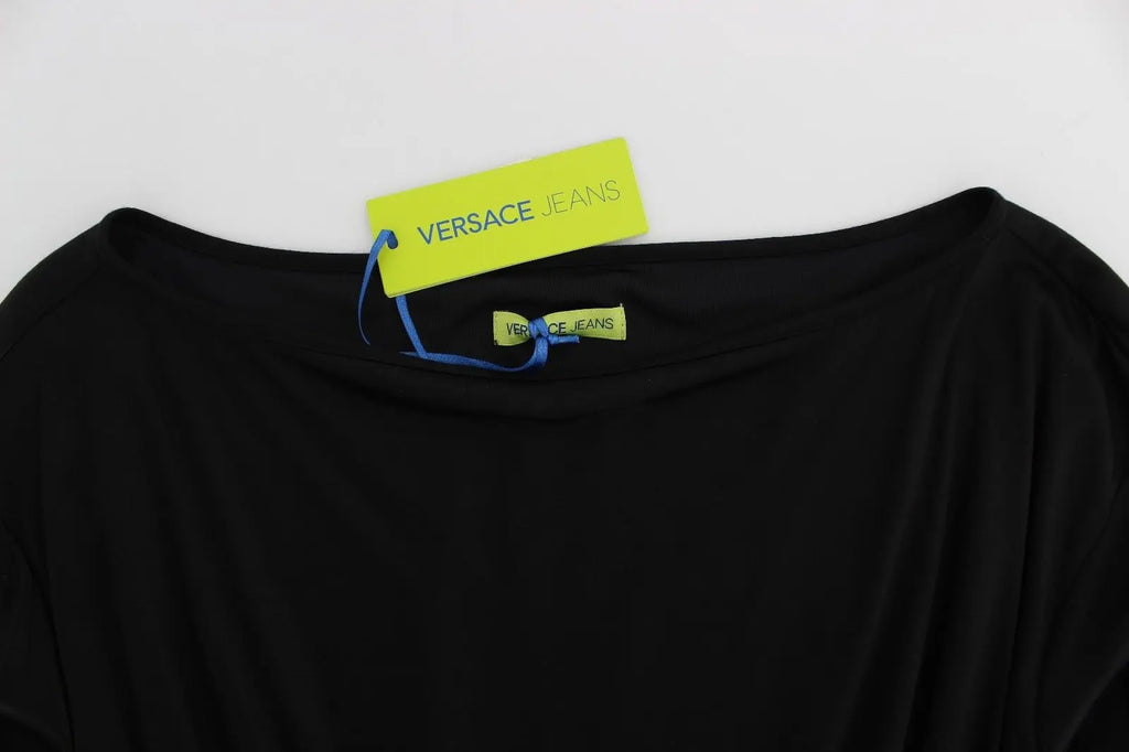 Black long-sleeve knee-length shift dress with boat neckline and drawstring waist.